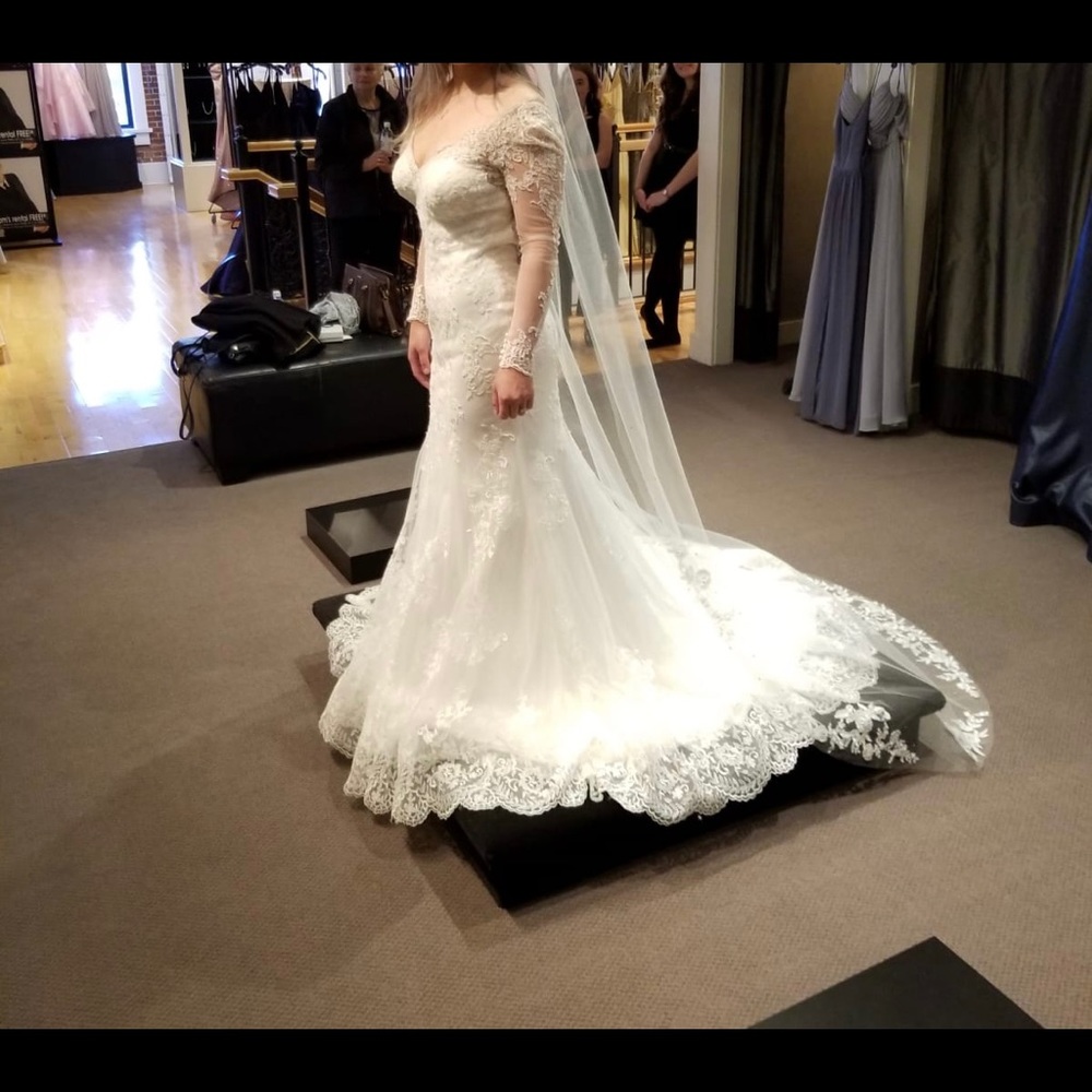 white wedding dress from the Bridal Gallery. Size 8. Never wore the dress